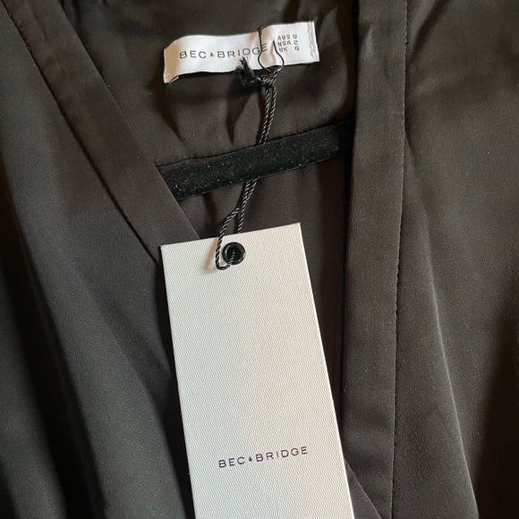 Classy black cocktail dress, stunning on! Open back and leather detail. BNWT - Picture 5 of 5